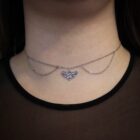 Gothic stainless steel silver choker with a moth pendant and layered chains dangling