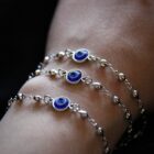 Delicate minimalist witchy stainless steel bracelet in silver with an evil eye charm