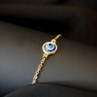 Delicate minimalist witchy stainless steel bracelet in gold with an evil eye charm
