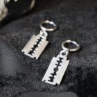 Cutthroat punk earrings with a razor blade charm in silver