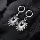 stainless steel earrings in silver which features a sacred heart pendant with minimalist punk vibes