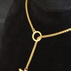 Unbound edgy gold necklace in stainless steel with adjustable hoop clasp