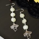 Witchy silver earrings with mushroom and upcycled green beads