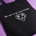 Black tote bag with traditional tattoo design of a crying heart